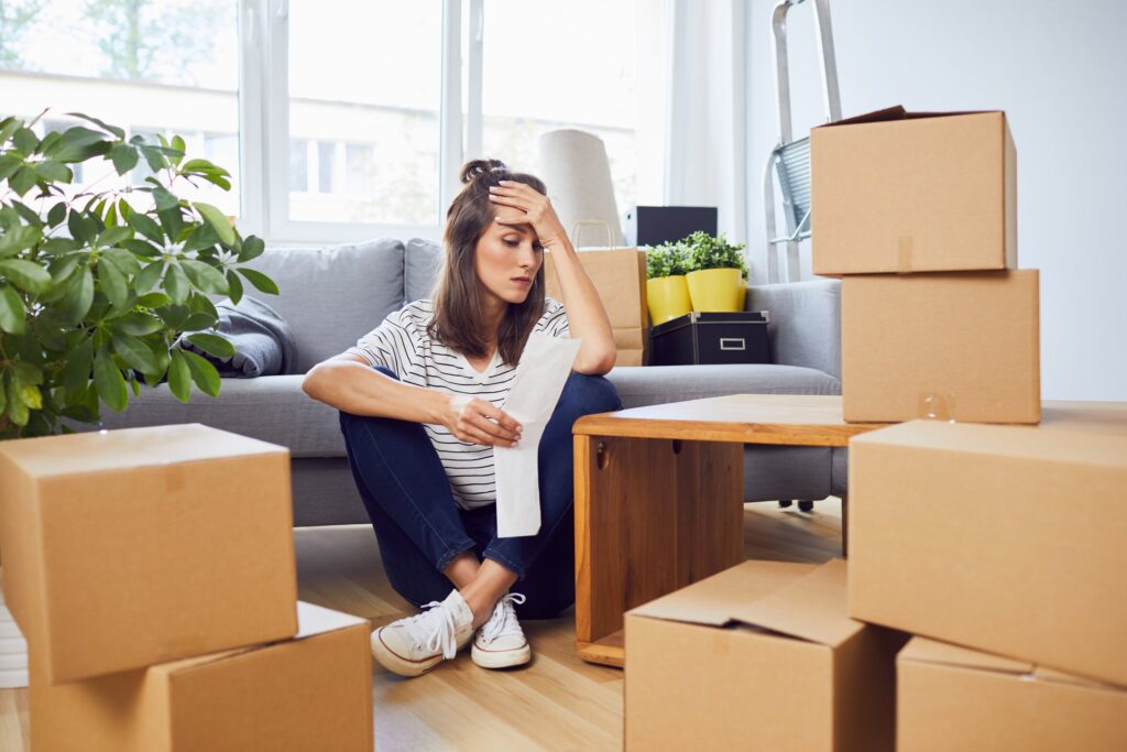 Woman surrounded by moving boxes