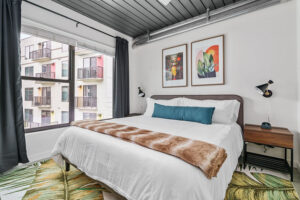 furnished bedroom with memory foam mattress and plush bedding