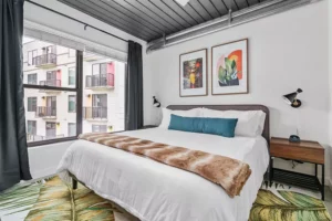 furnished bedroom with memory foam mattress and plush bedding