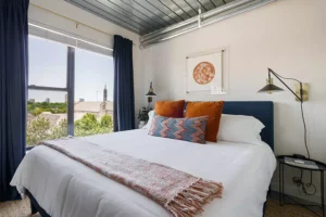 furnished bedroom with king-sized memory foam mattress and plush bedding