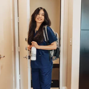 Image of a travel nurse walking into a Lodgeur furnished apartment