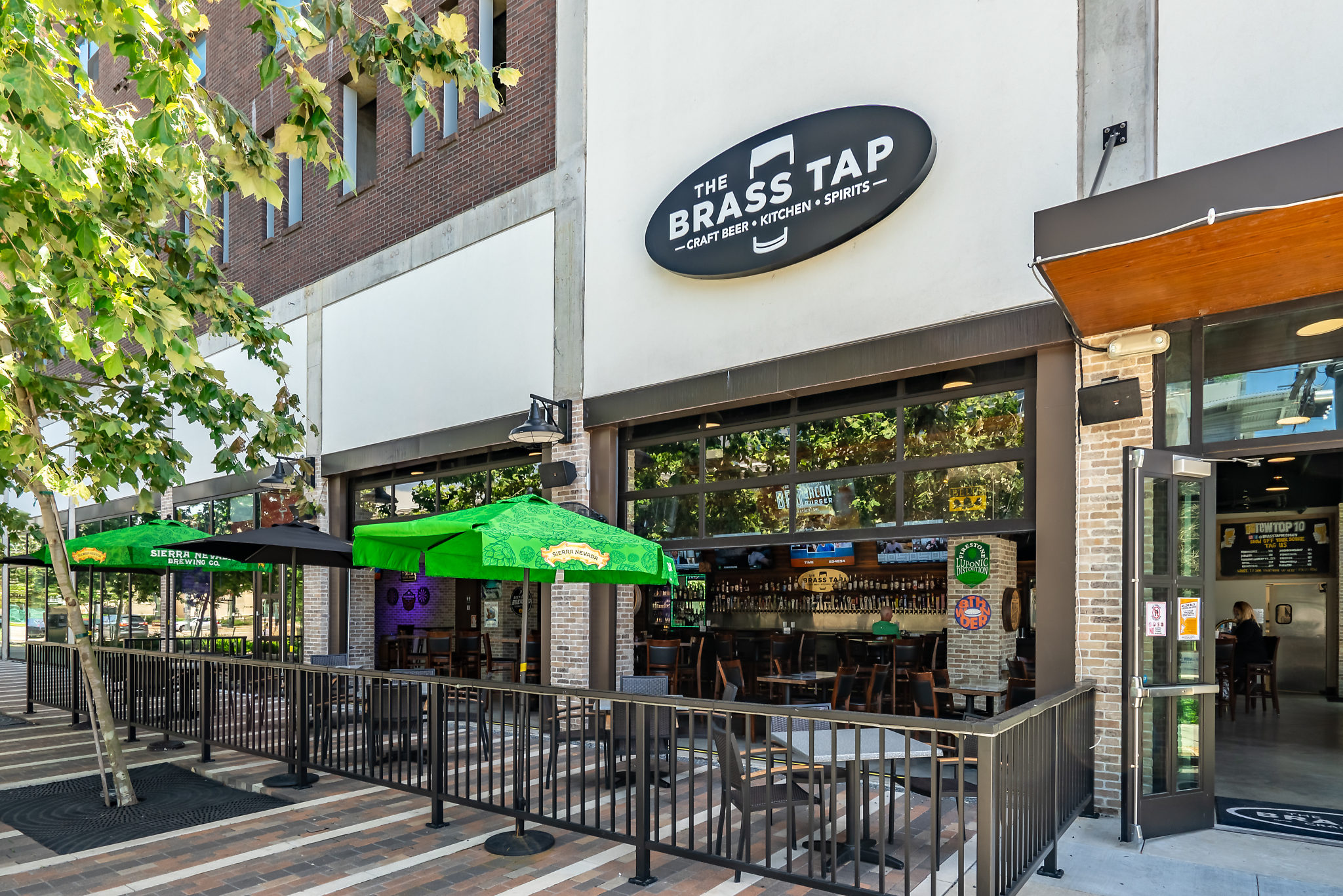 The Brass Tap is a neighborhood bar and restaurant located at Mid Main Lofts