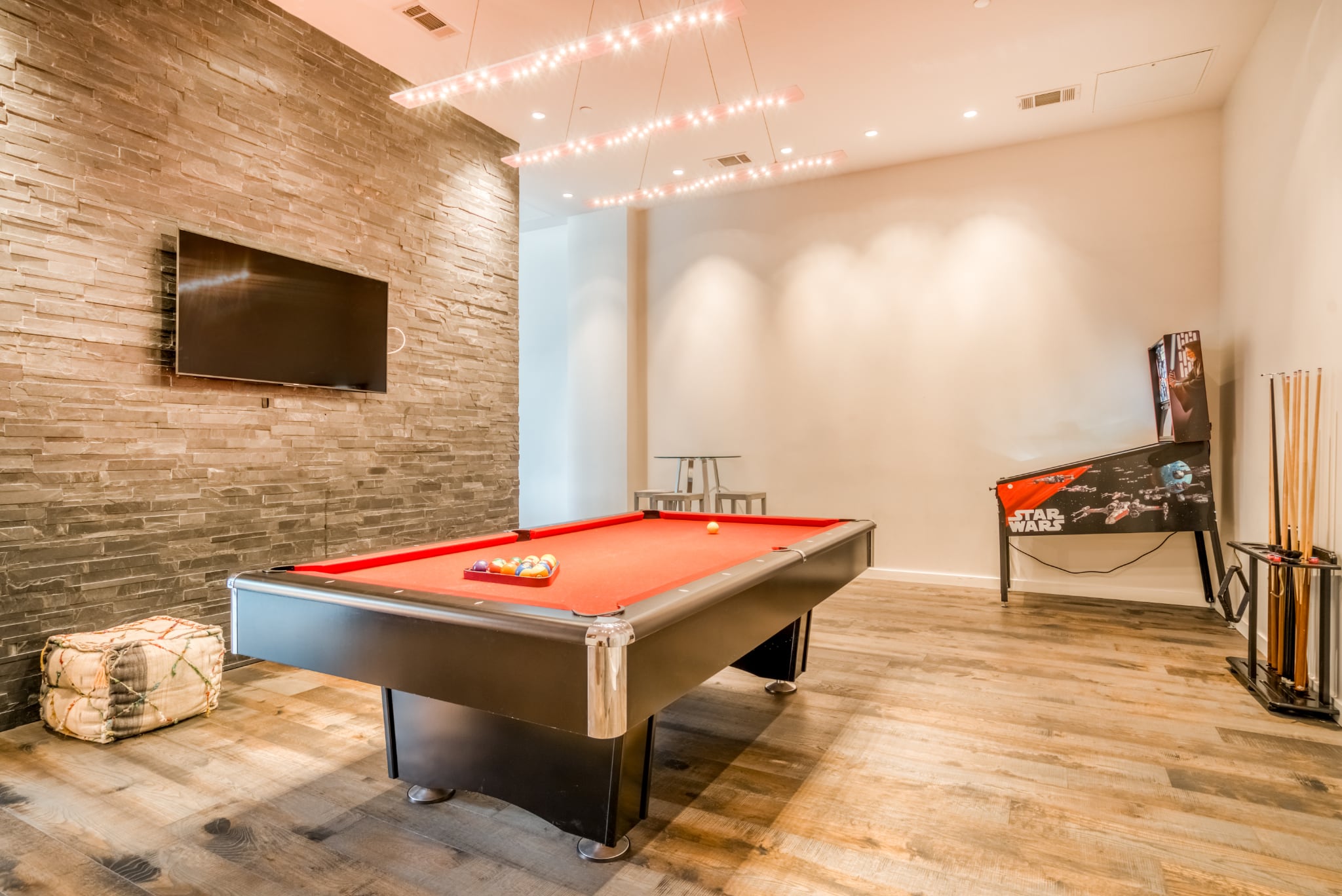 The residents' games room at Mid Main Lofts with a pool table and pinball machine
