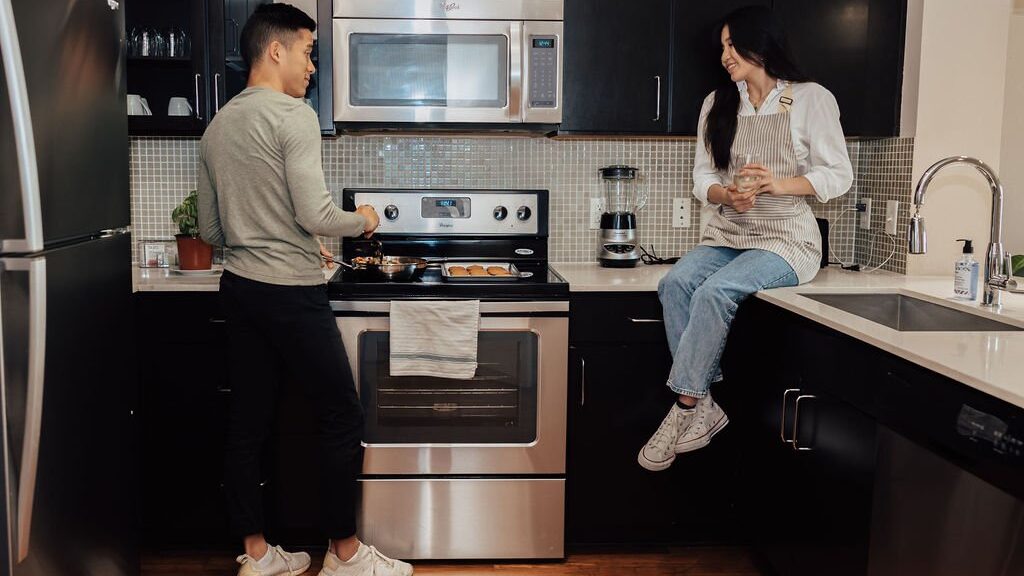 couple in the kitchen preparing a meal