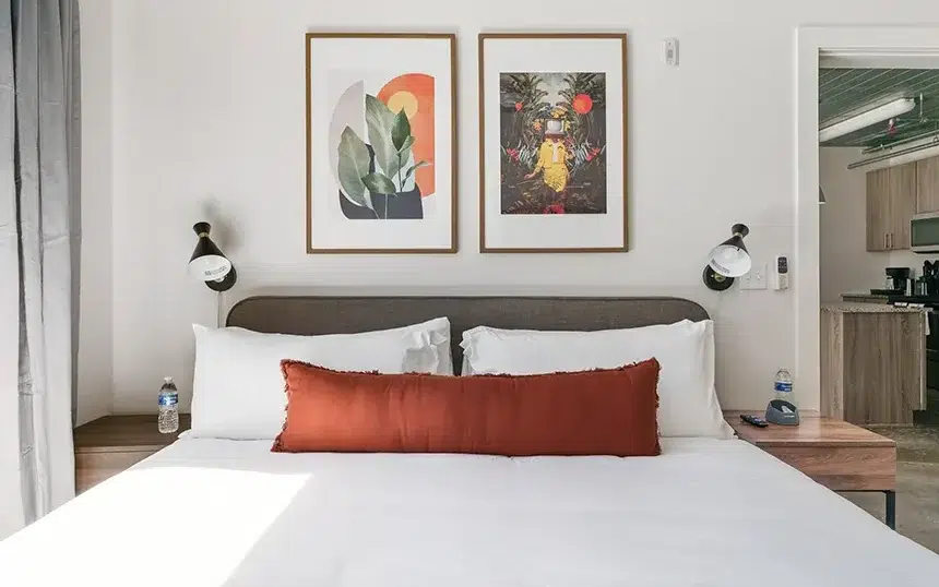 furnished bedroom with memory foam mattress and plush bedding