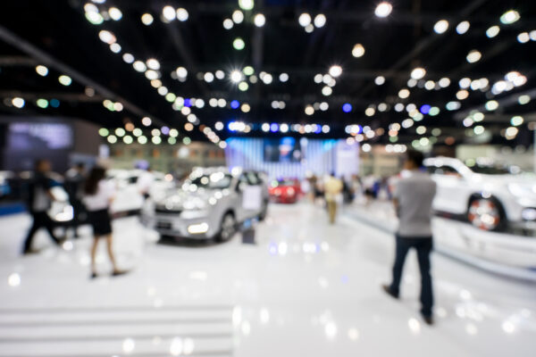 blur photo of motor show, car show room