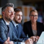 Professionals at a conference, attentively listening to a lecture