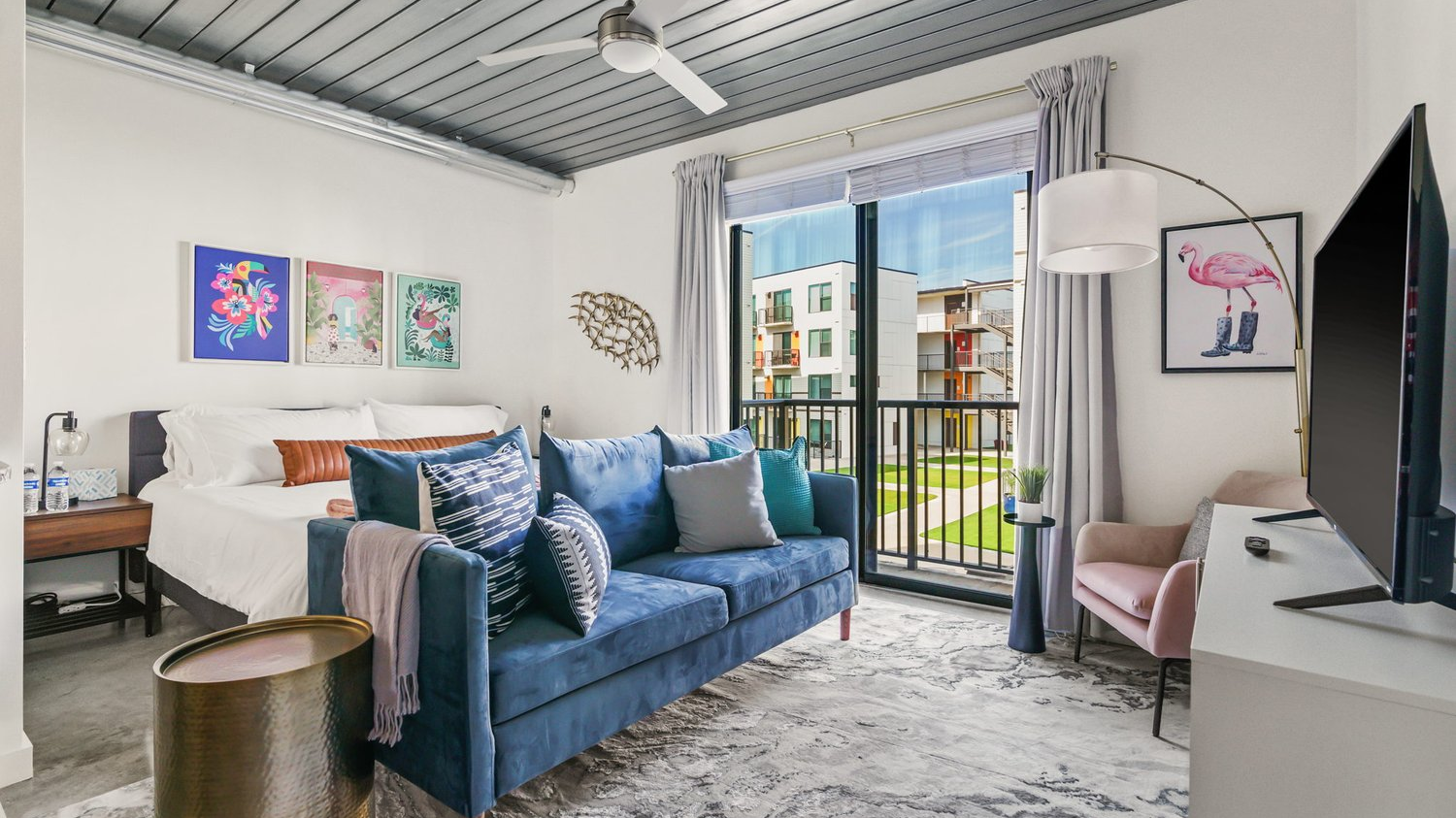Furnished studio apartment with blue couch