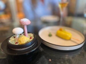 Musaafer's popular mushroom shaped yogurt dessert - mishti doi and mango dessert