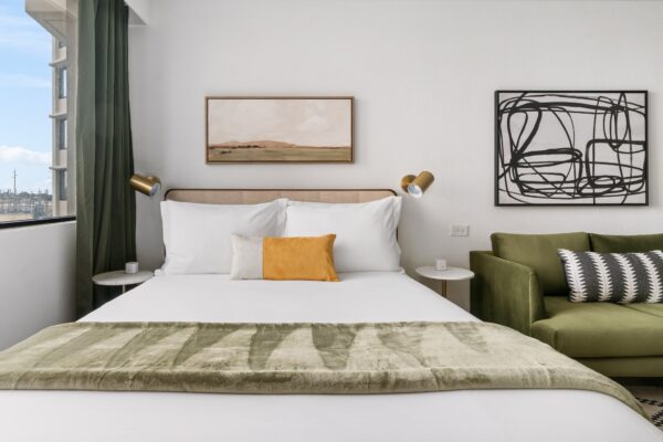 Queen bed and sofa in Lodgeur Upper Kirby